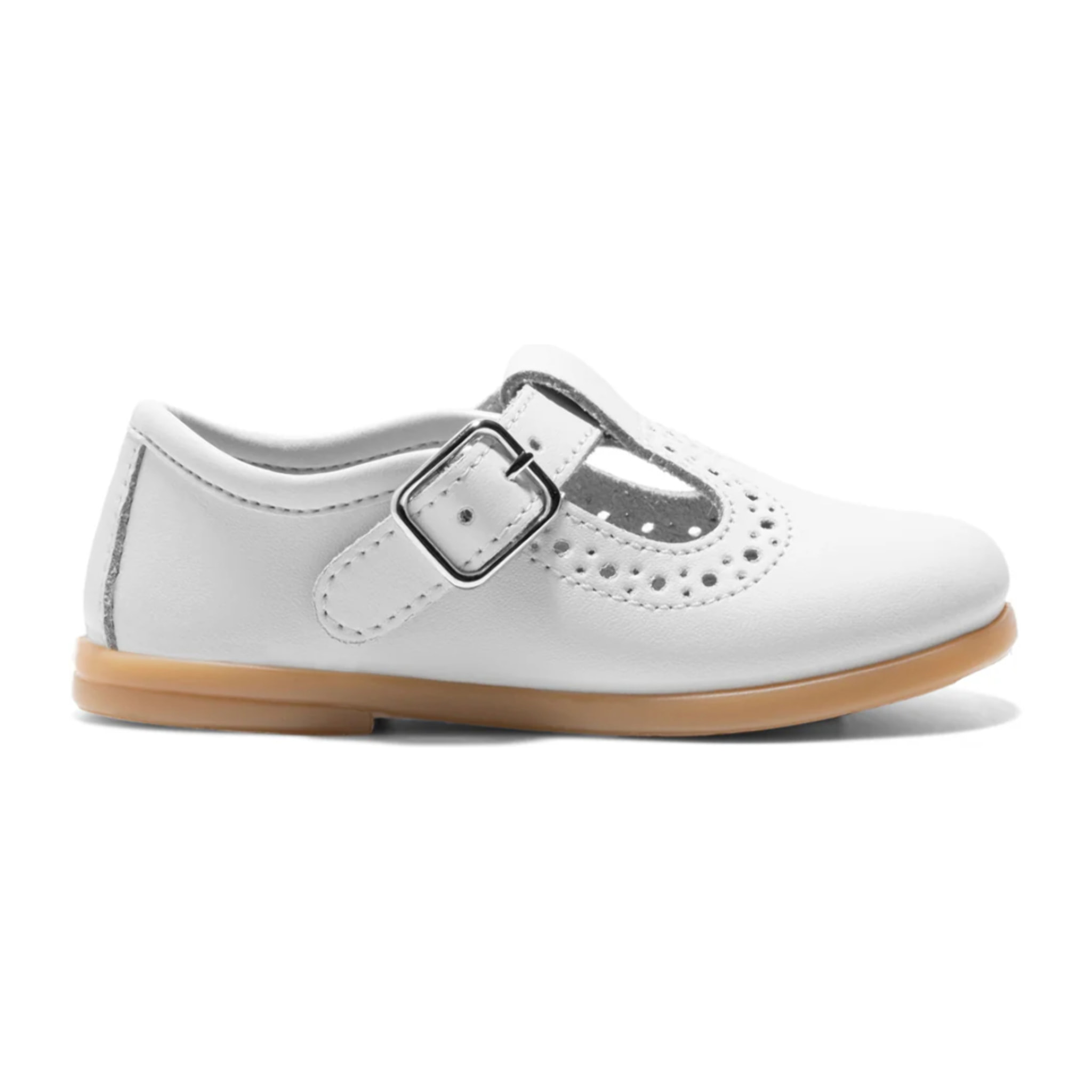 Scarpe Mary Jane da bambina, bianche, con un disegno fustellato.