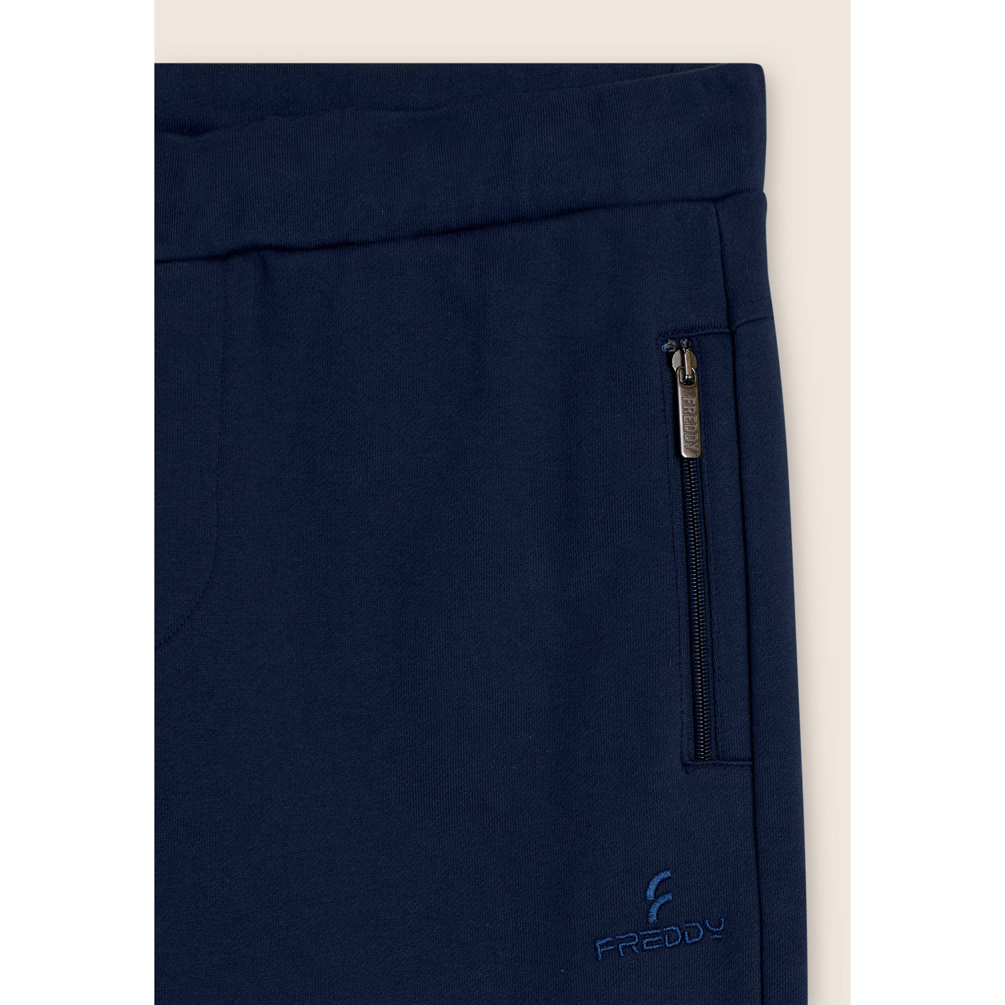 Pantaloni sportivi con tasche zippate