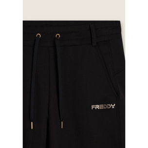 Pantaloni slim fit con spacchi laterali
