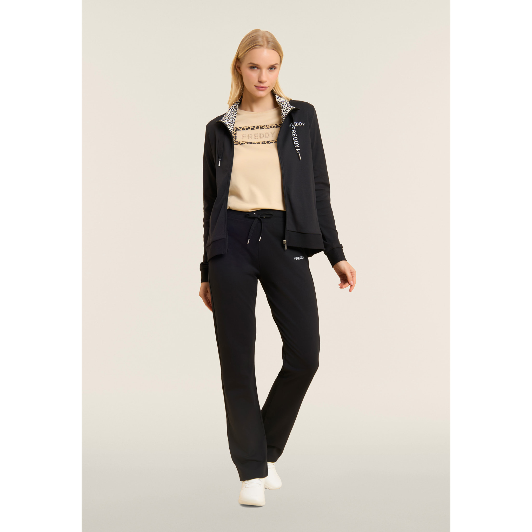 Tuta con zip e collo alto con interno animalier