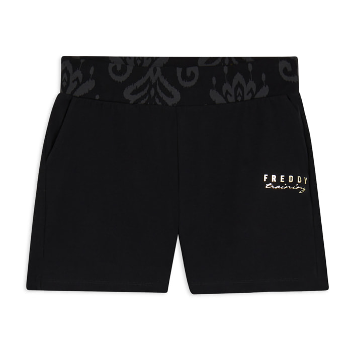 Short sportivi con fascia in vita floreale