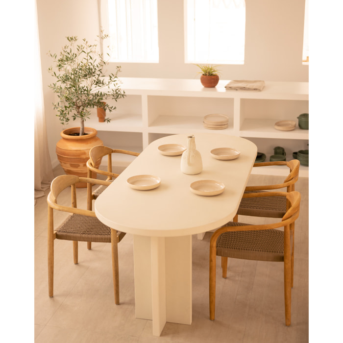 Table de salle à manger ovale en microciment de teinte blanc cassé disponible en différentes tailles