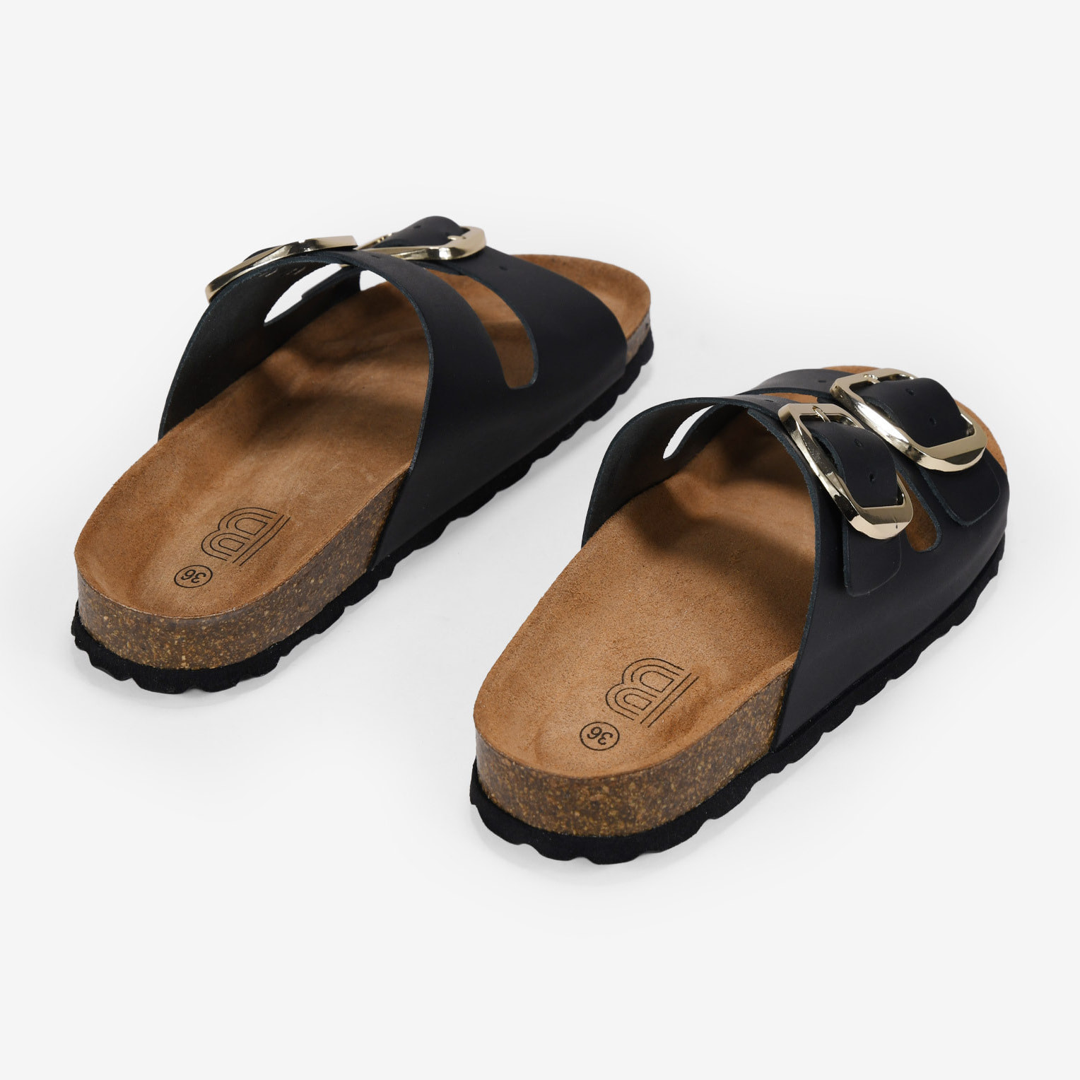 Sandalias planas negras en piel con doble hebilla
