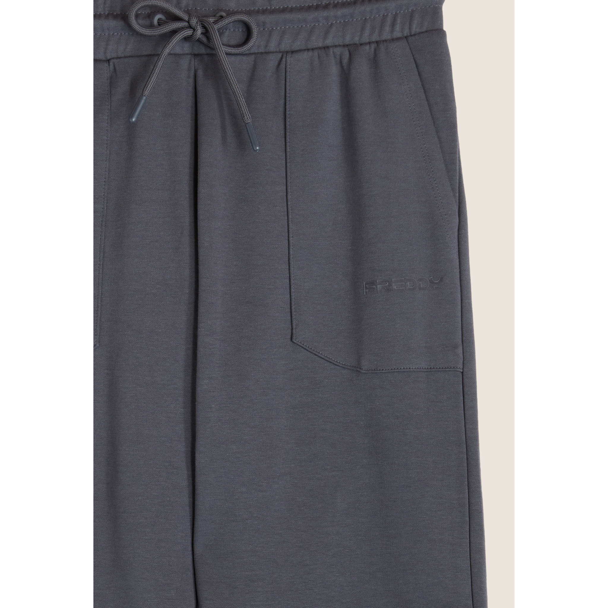 Pantaloni slim in interlock con stampa UT e cuciture