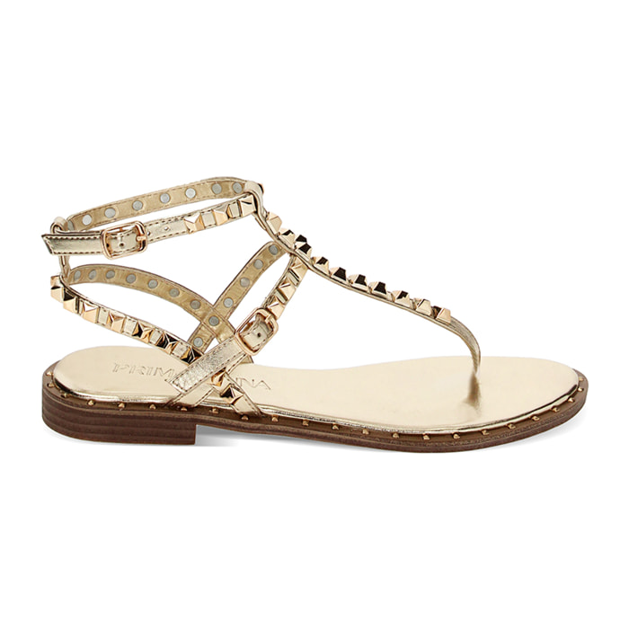 Sandalias planas doradas en laminado