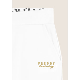 Pantaloni regular fit con fondo dritto con piccoli spacchi