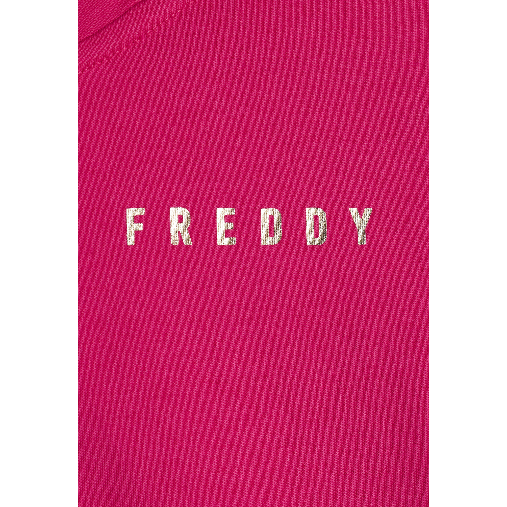 Tuta donna con zip, collo alto e spacchi laterali su fondo gamba