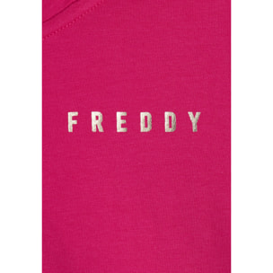 Tuta donna con zip, collo alto e spacchi laterali su fondo gamba