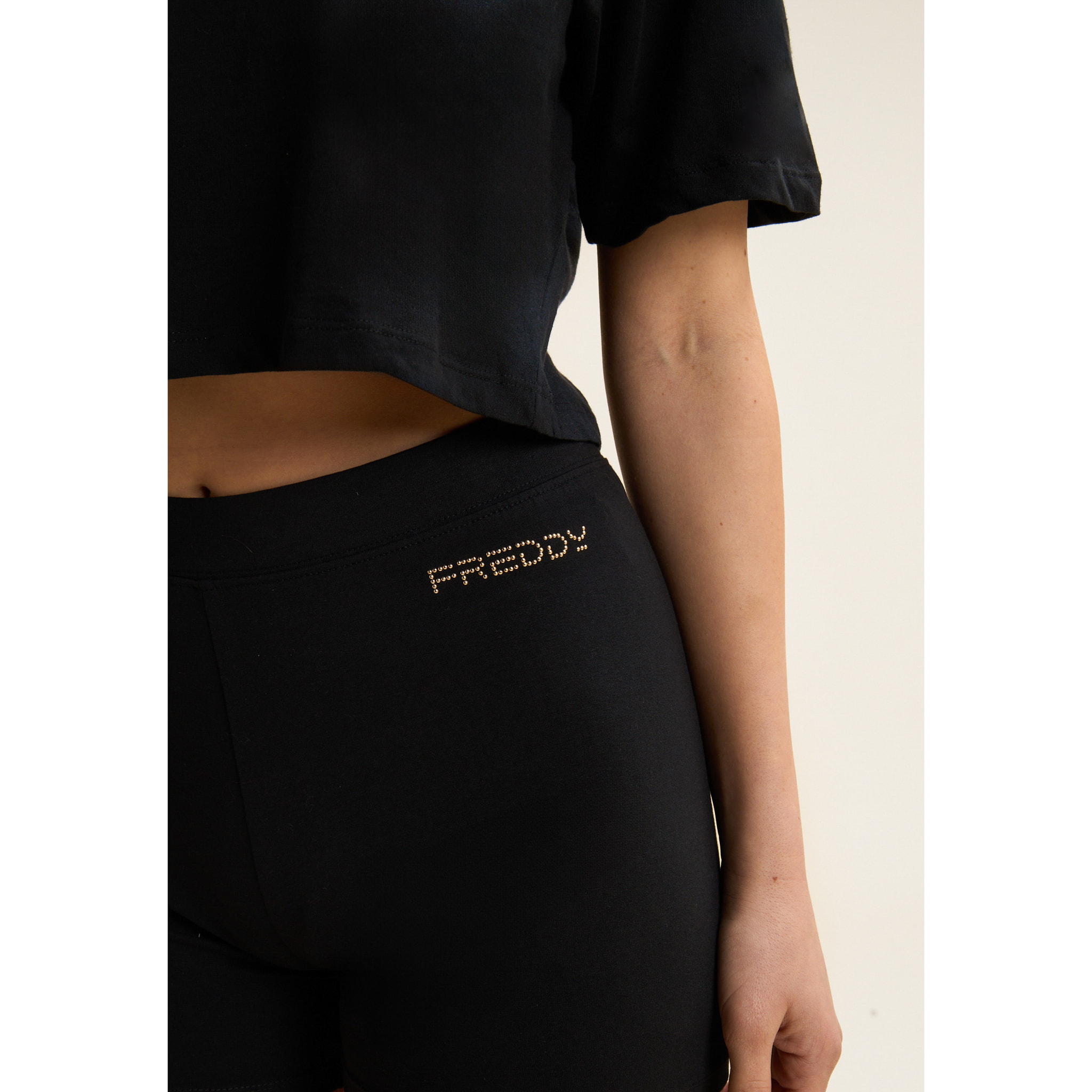 Leggings corti in jersey con logo scintillante