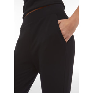 Pantaloni in french terry modal con logo borchiato sul fondo