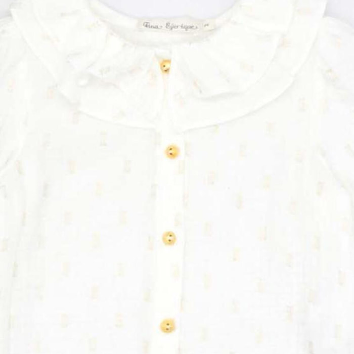 Blusa con doble cuello y manga con volumen en dorado y blanco