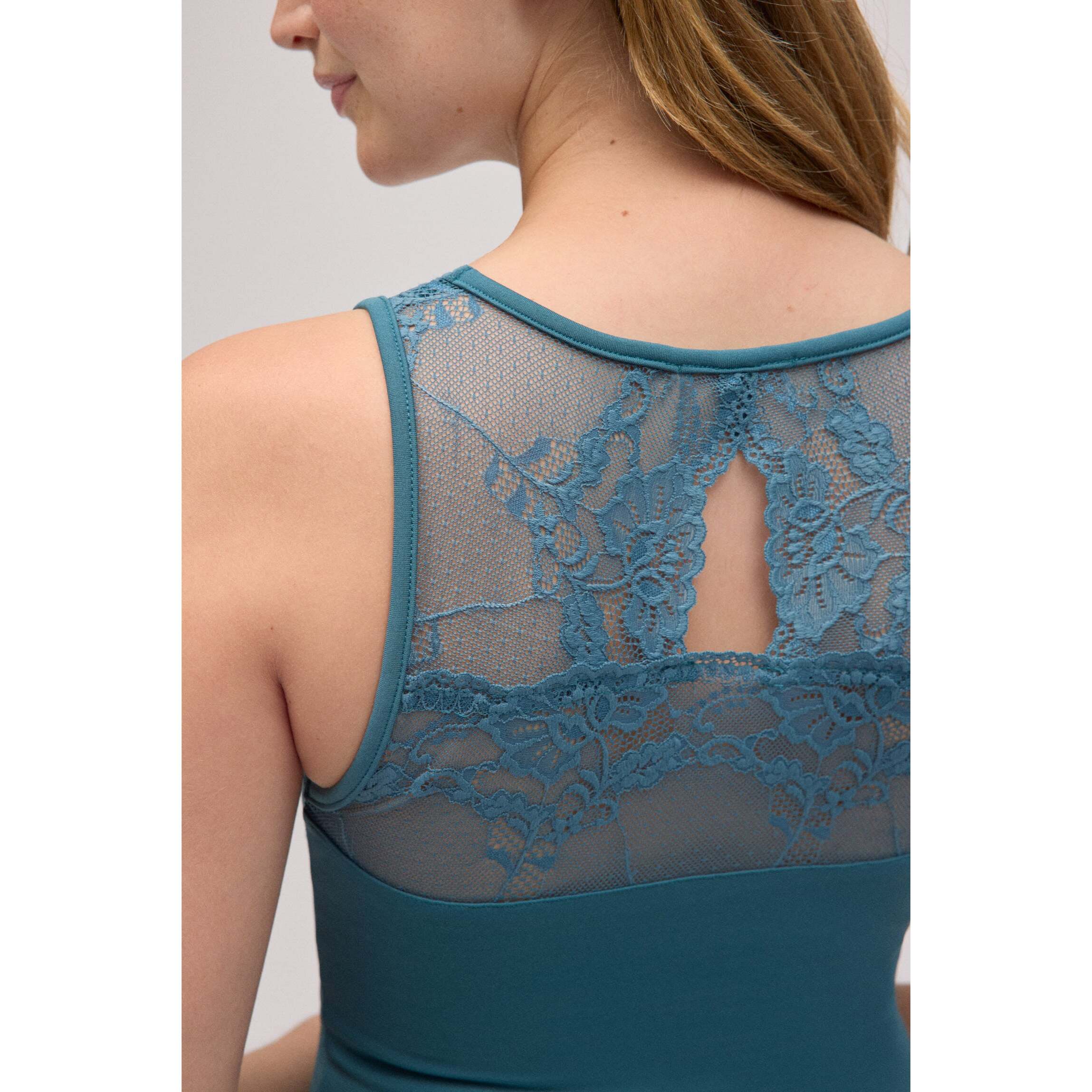 Maglia termica in pizzo verde senza maniche