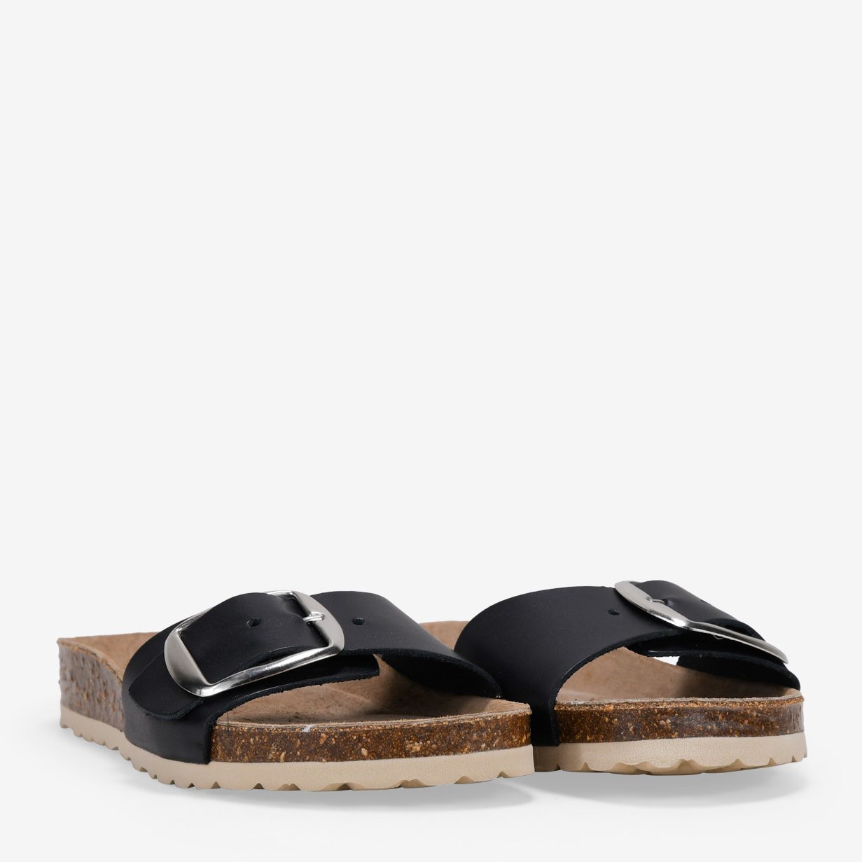 Sandalias planas negras en piel con hebilla grande