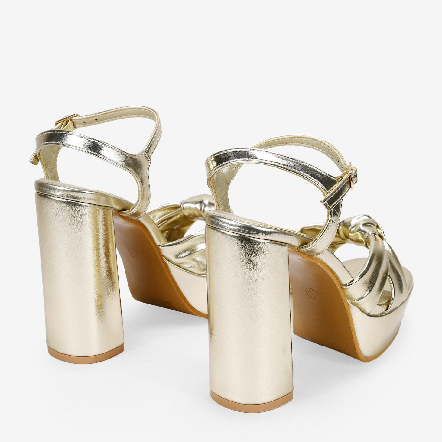 Sandalias de tacón doradas con nudo