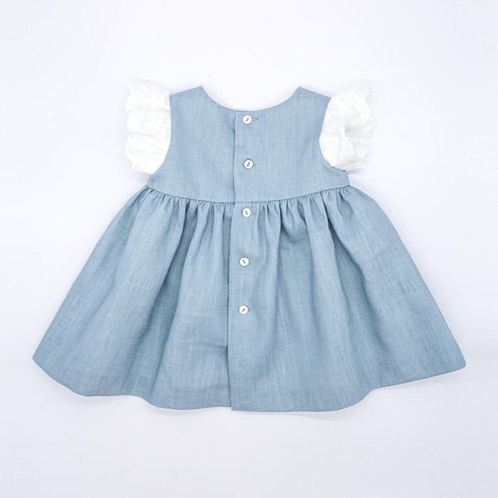 Vestido corto de lino verde, tira bordado en las sisas y los bolsillos.