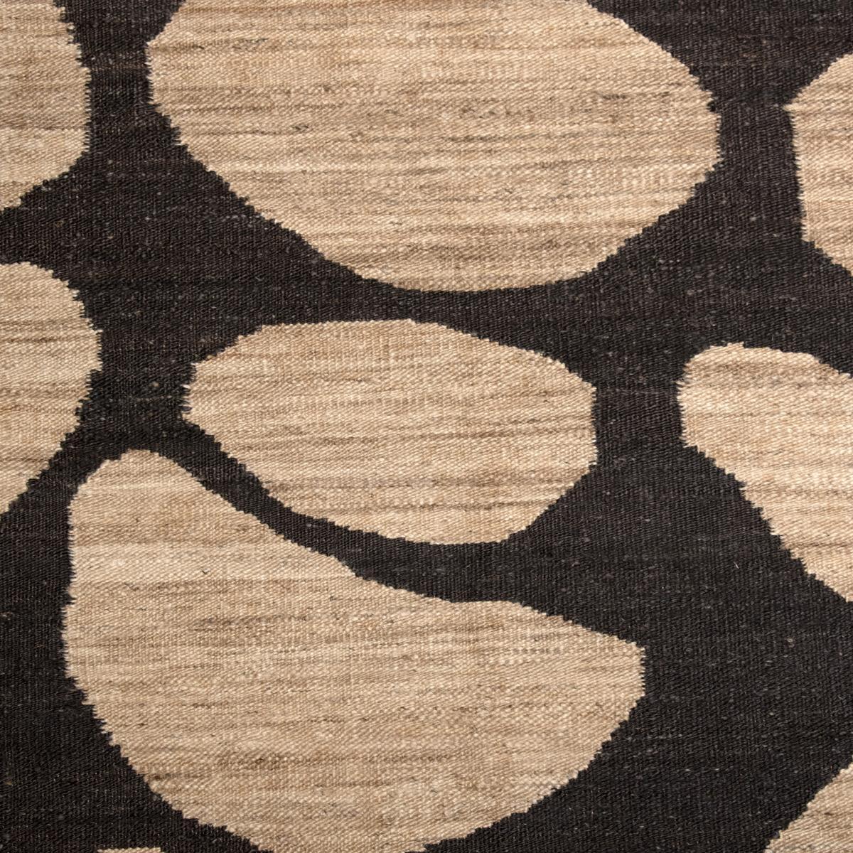 Tapis Kilim FIca tissé à la main en jute avec des formes rondes pour motif