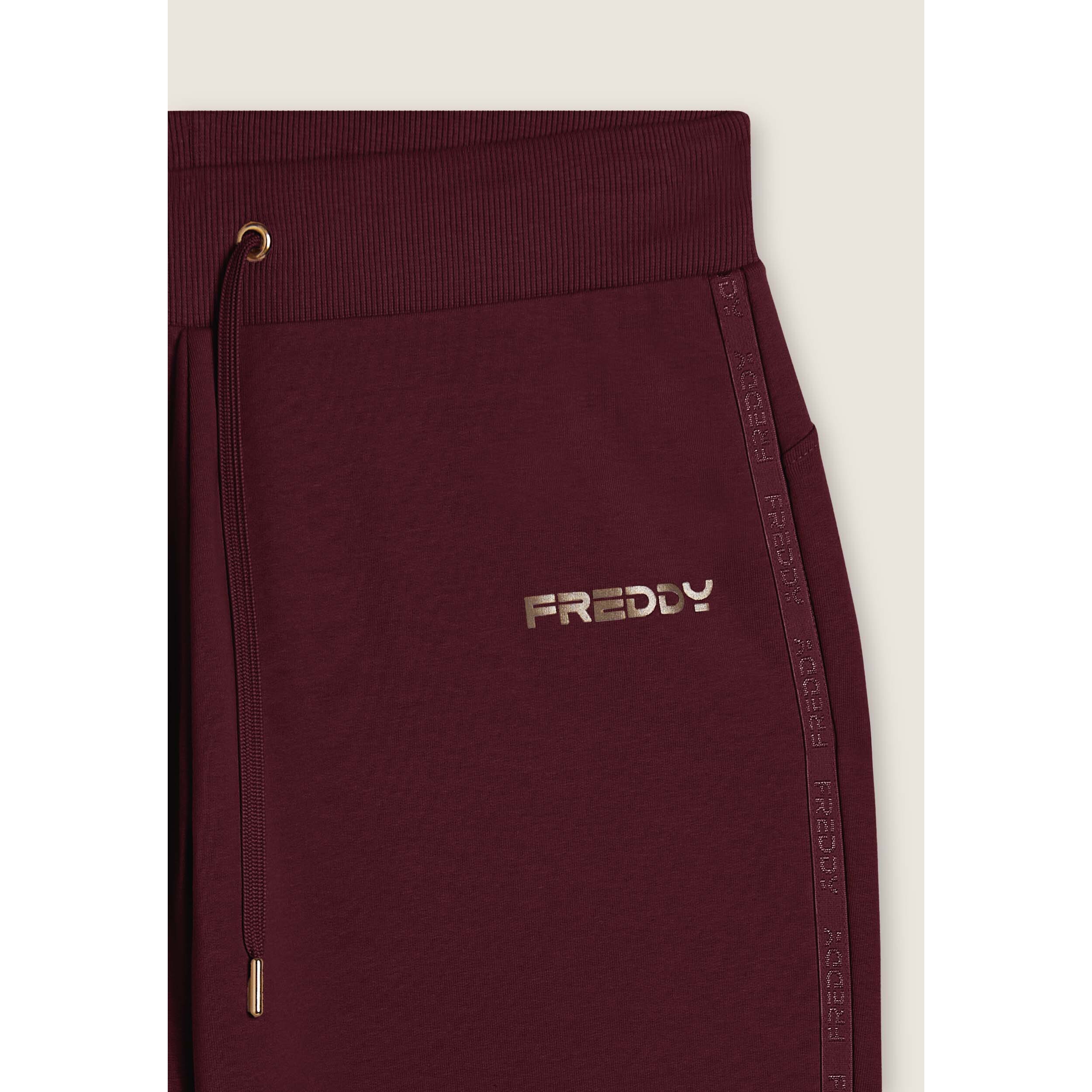 Pantaloni con fondo a costina e bande logate