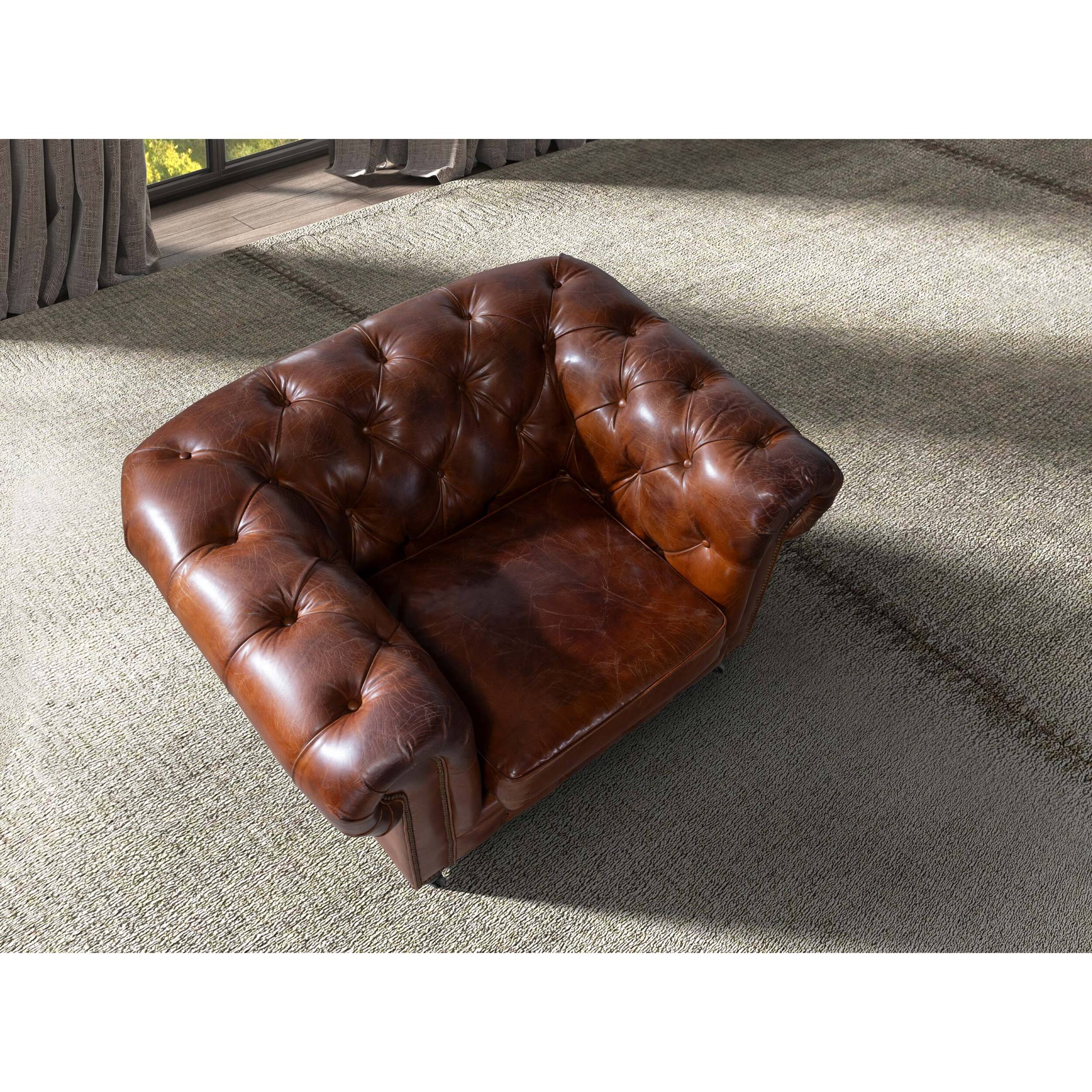 Sillón Chester con reposabrazos con asiento y respaldo tapizados en piel de origen vacuno en marrón coñac patas de madera maciza tintada en caoba 120x94x79cm