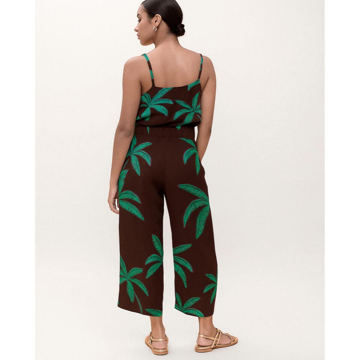 Pantaloni con sfondo marrone e palme