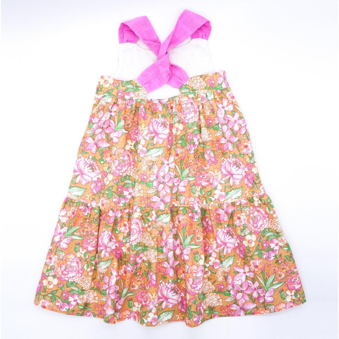 Vestido midi de popelín ocre flores rosas. Falda de volantes y tirantes cruzados en la espalda.