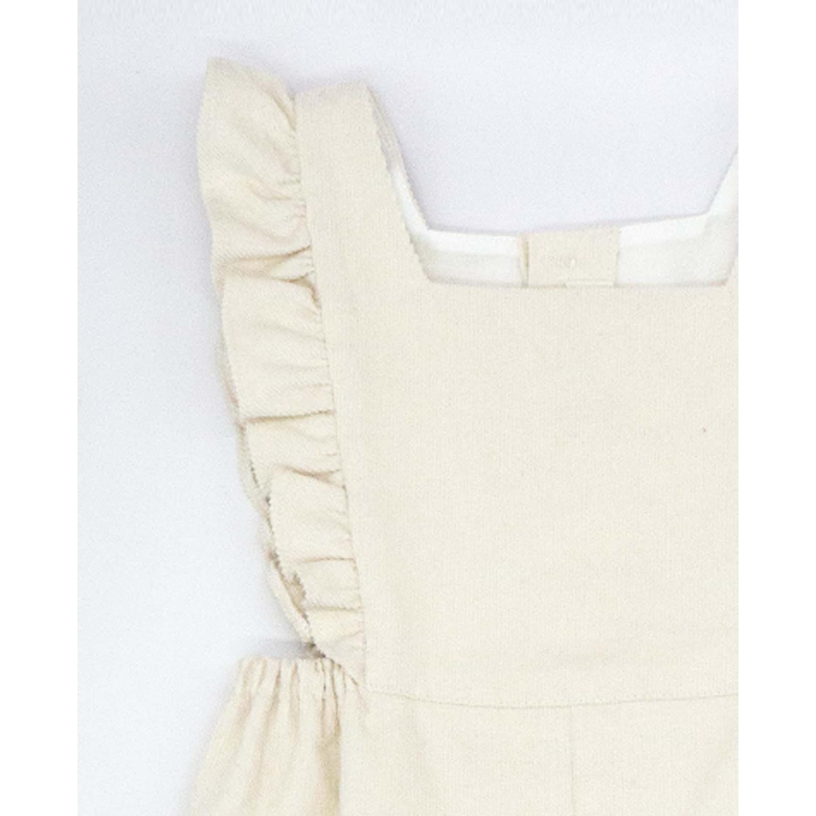 Peto con volantes blancos