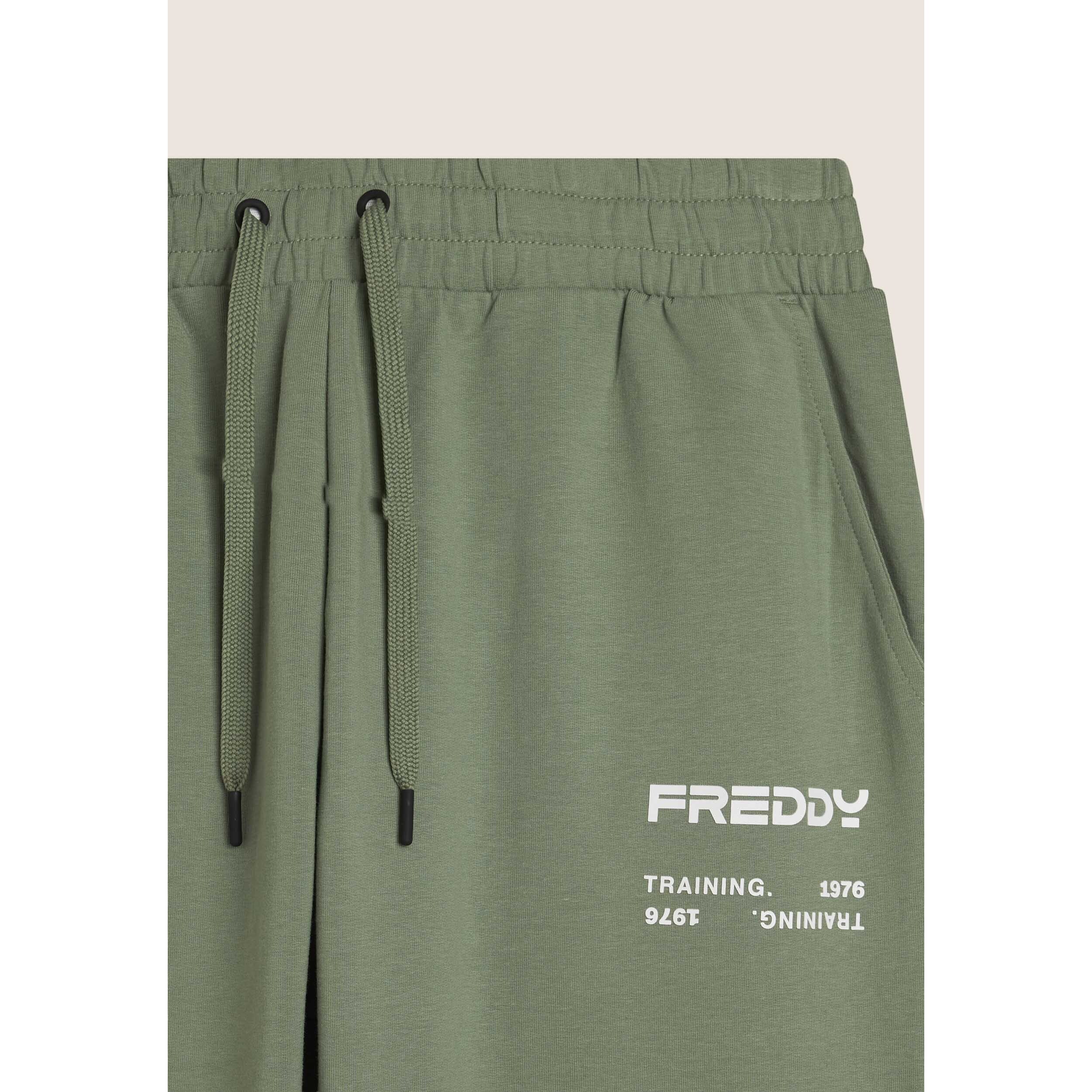 Pantaloni sportivi con bande laterali e fondo a polsino