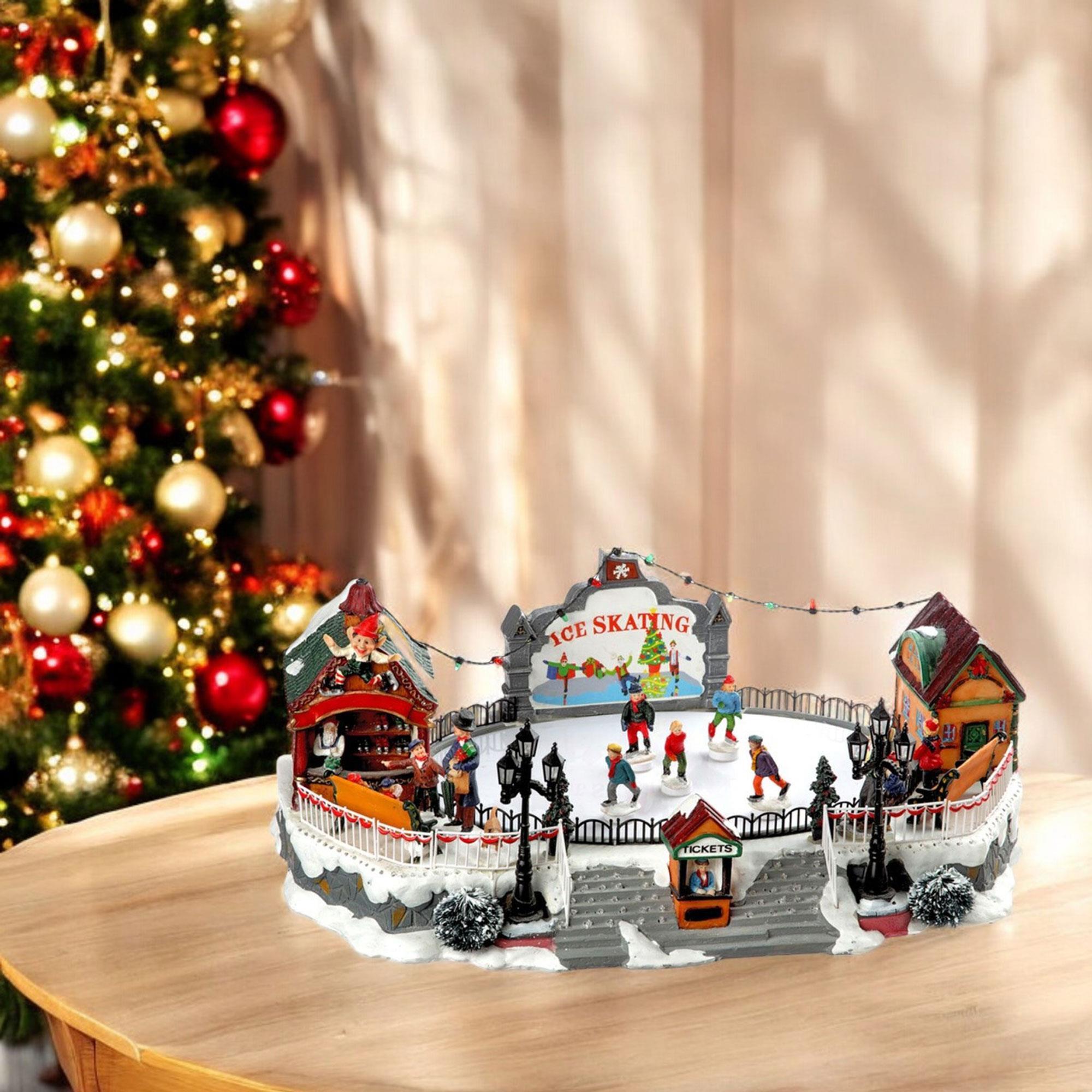 Pista de patinaje de decoración navideña con luces led y movimiento 21x22,5x39cm