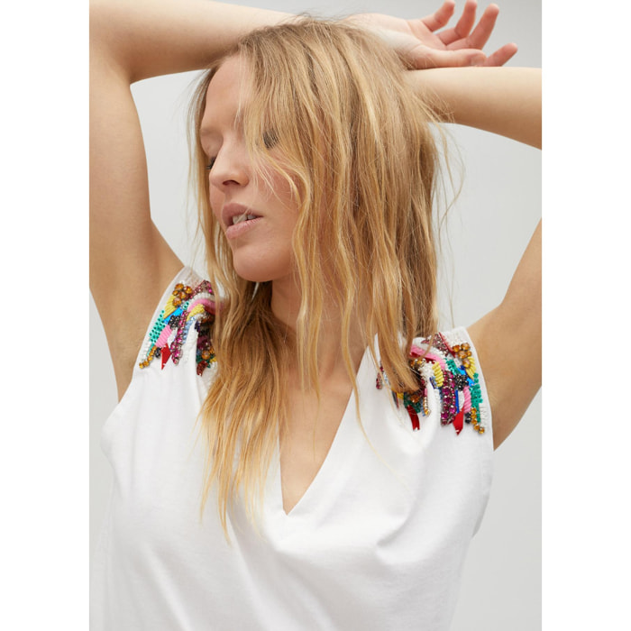 Maglietta strass sulle spalle