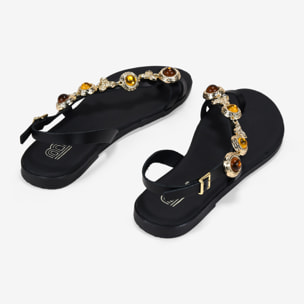 Sandalias planas negras en piel con tira joya