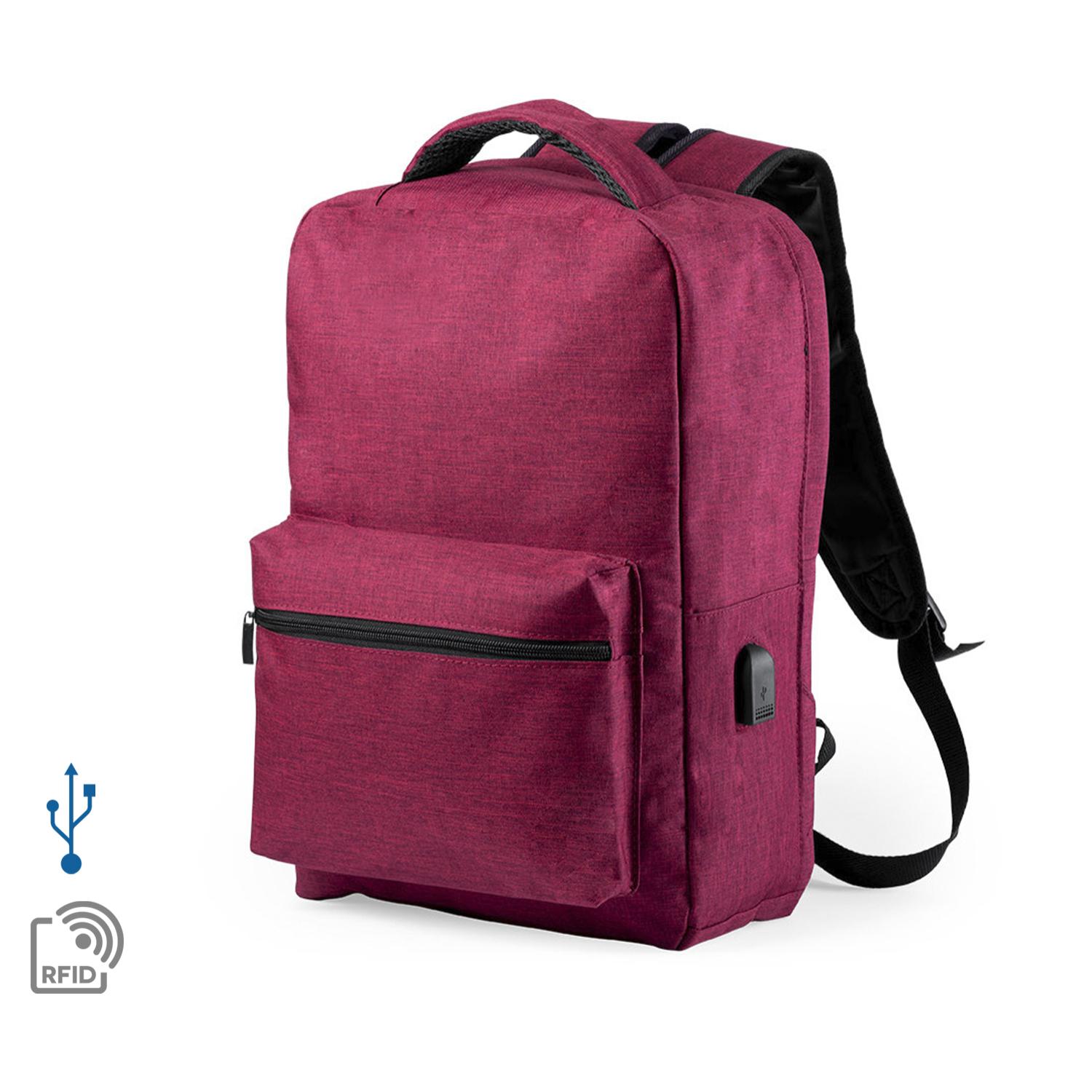 Mochila antirrobo Komplete de poliester 300D, con toma USB exterior. Bolsillo en lateral con protección RFID.