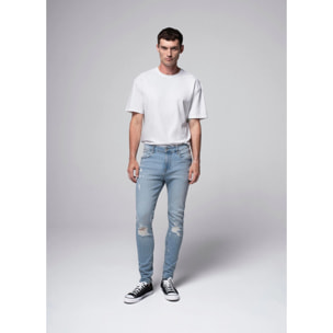 Jeans skinny con rotture