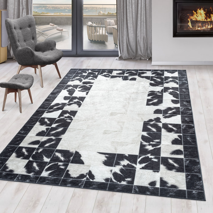 FIESTA - Tapis patchwork imitation peau noir et blanc