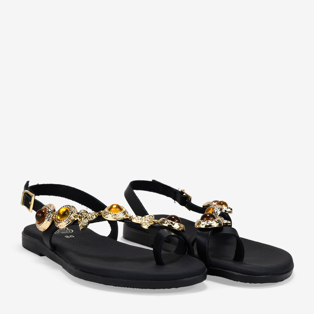 Sandalias planas negras en piel con tira joya