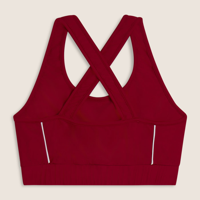 Top tecnico con spalline incrociate e profili bianchi