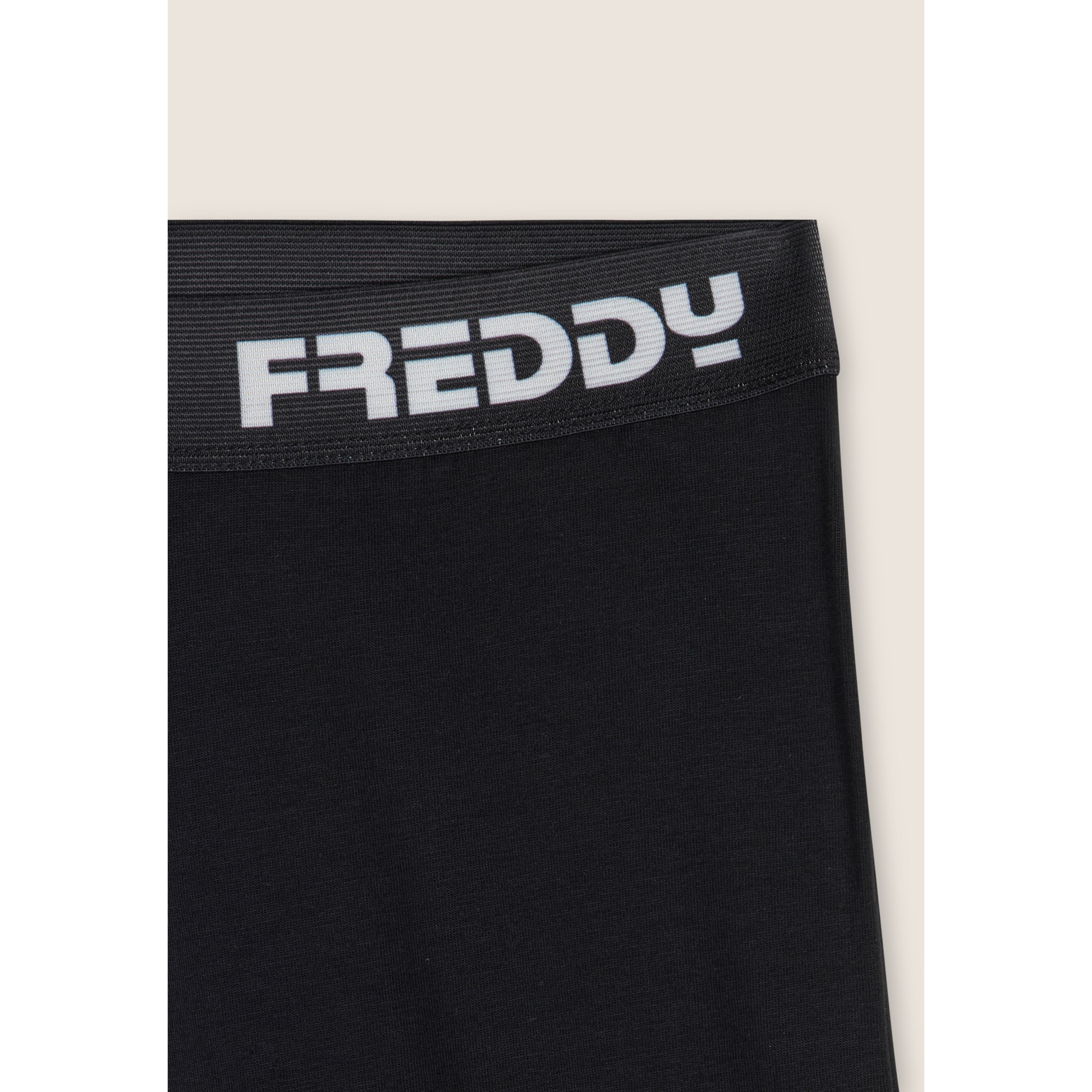 Pantaloni sportivi a zampa con elastico logato