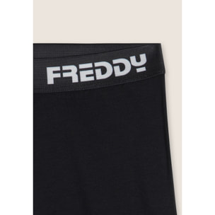 Pantaloni sportivi a zampa con elastico logato