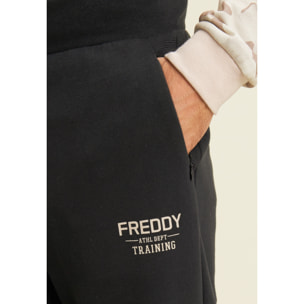 Pantaloni in felpa con fondo a polsino e dettagli rigati