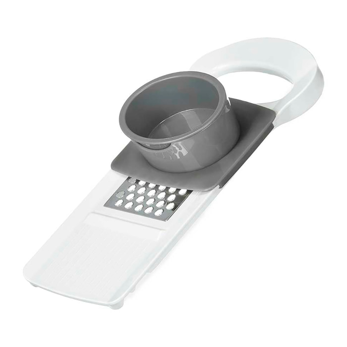 Confezione da 2 grattugie con manico e 4 tipi di tagli. Assortimento casuale di 2 colori