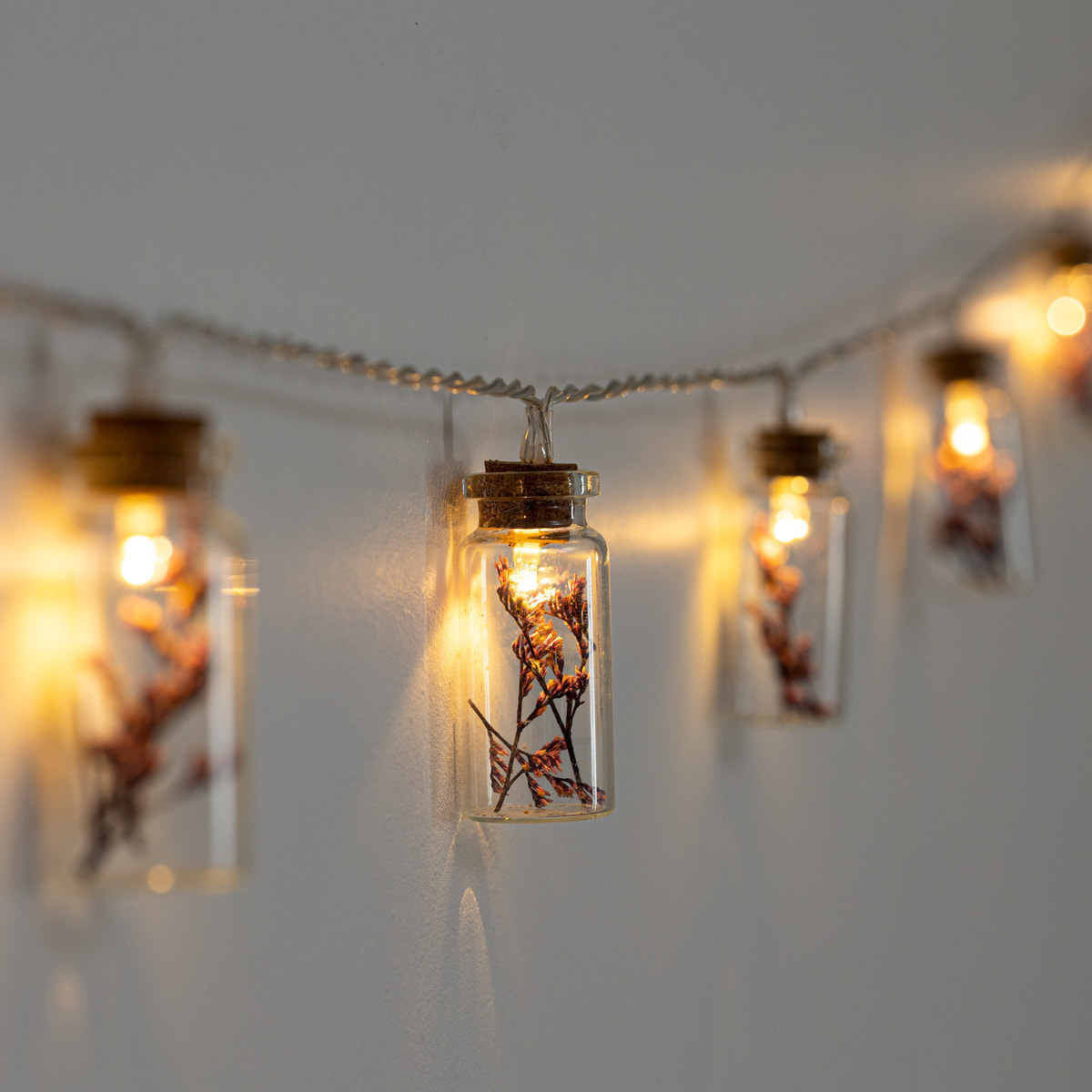 Guirlande LED à pile - 10 fleurs - verre - violet - L165 cm