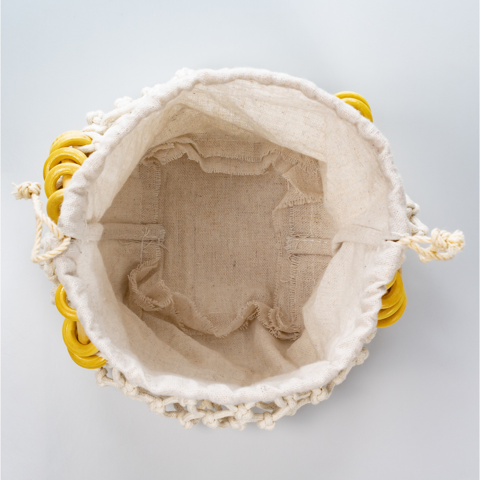 Zignago borsa a mano in cotone e manici in legno.