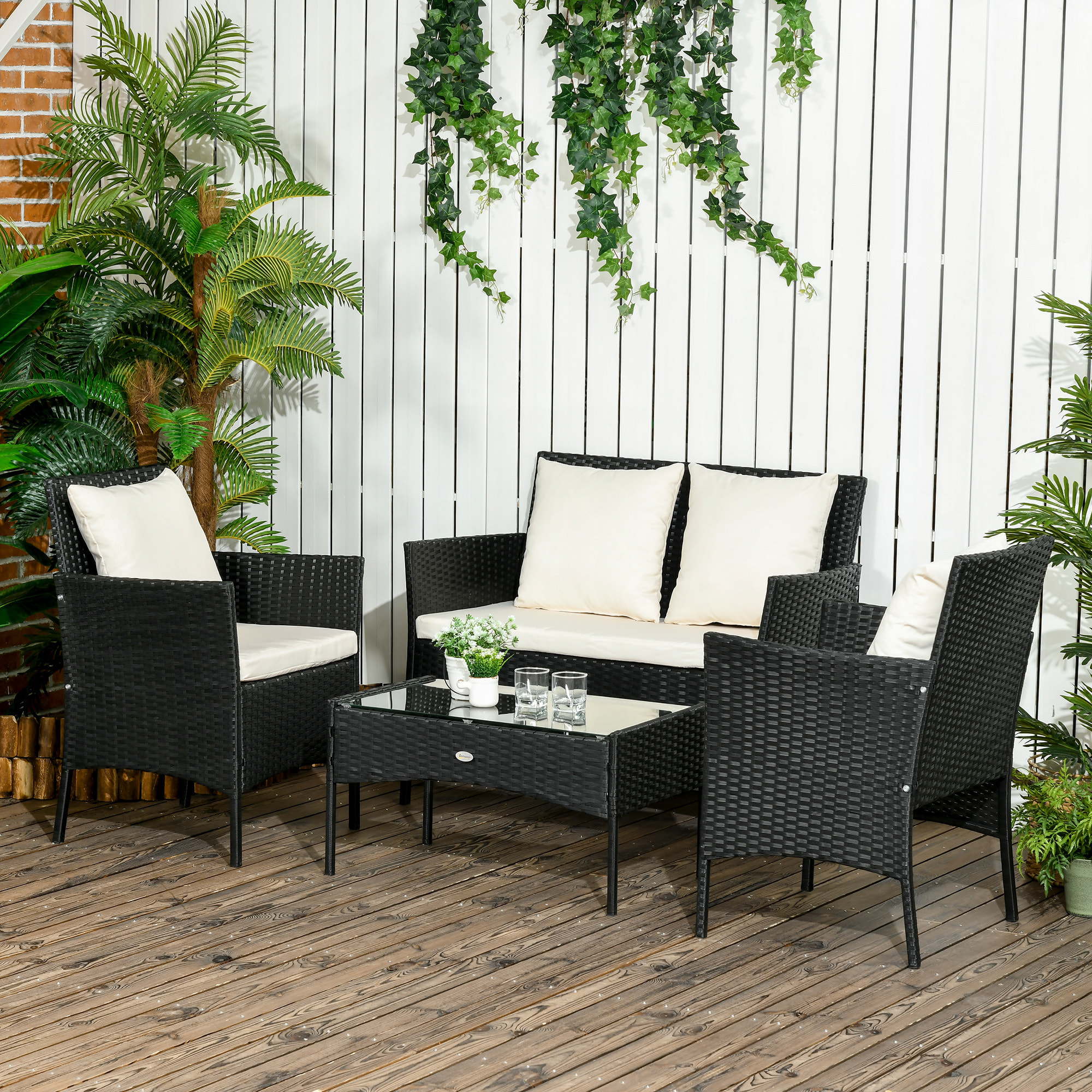 Conjunto de Jardín de Ratán Sintético Juego de 4 Piezas Muebles de Jardín con 2 Sillones 1 Sofá de 2 Plazas 1 Mesa de Centro con Tablero de Vidrio y Cojines Negro y Crema
