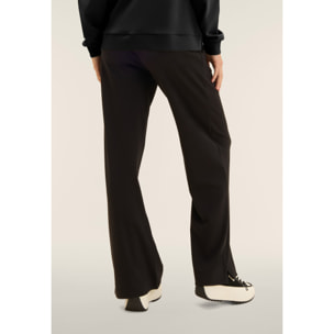 Tuta con zip e collo alto, pantaloni wide leg