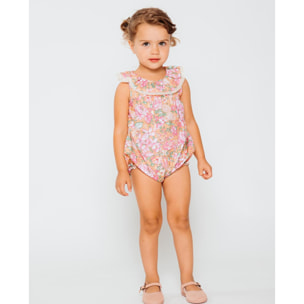 Pelele volante ocre con flor rosa