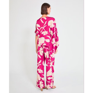 Pantaloni a gamba larga con grandi fiori di bouganville