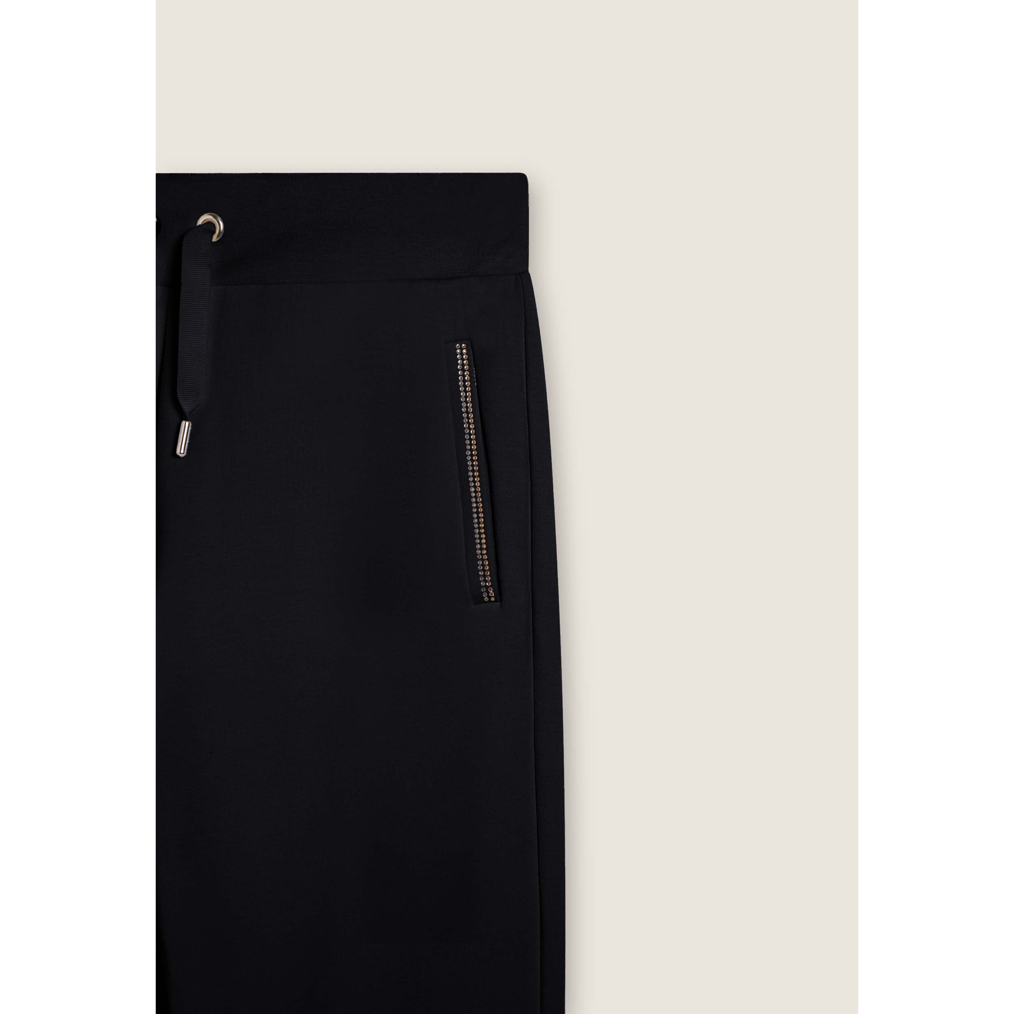 Pantaloni sportivi con gamba dritta e dettagli luminosi