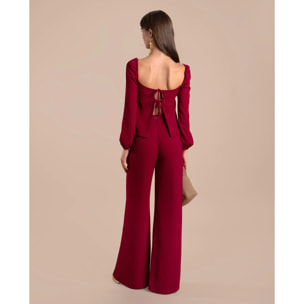 Blusa de manga larga con lazos en la espalda.