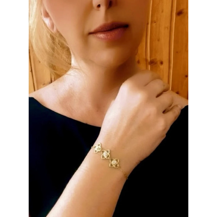 Pulsera Mismy dorado Tres flores y cristal SW color cristal