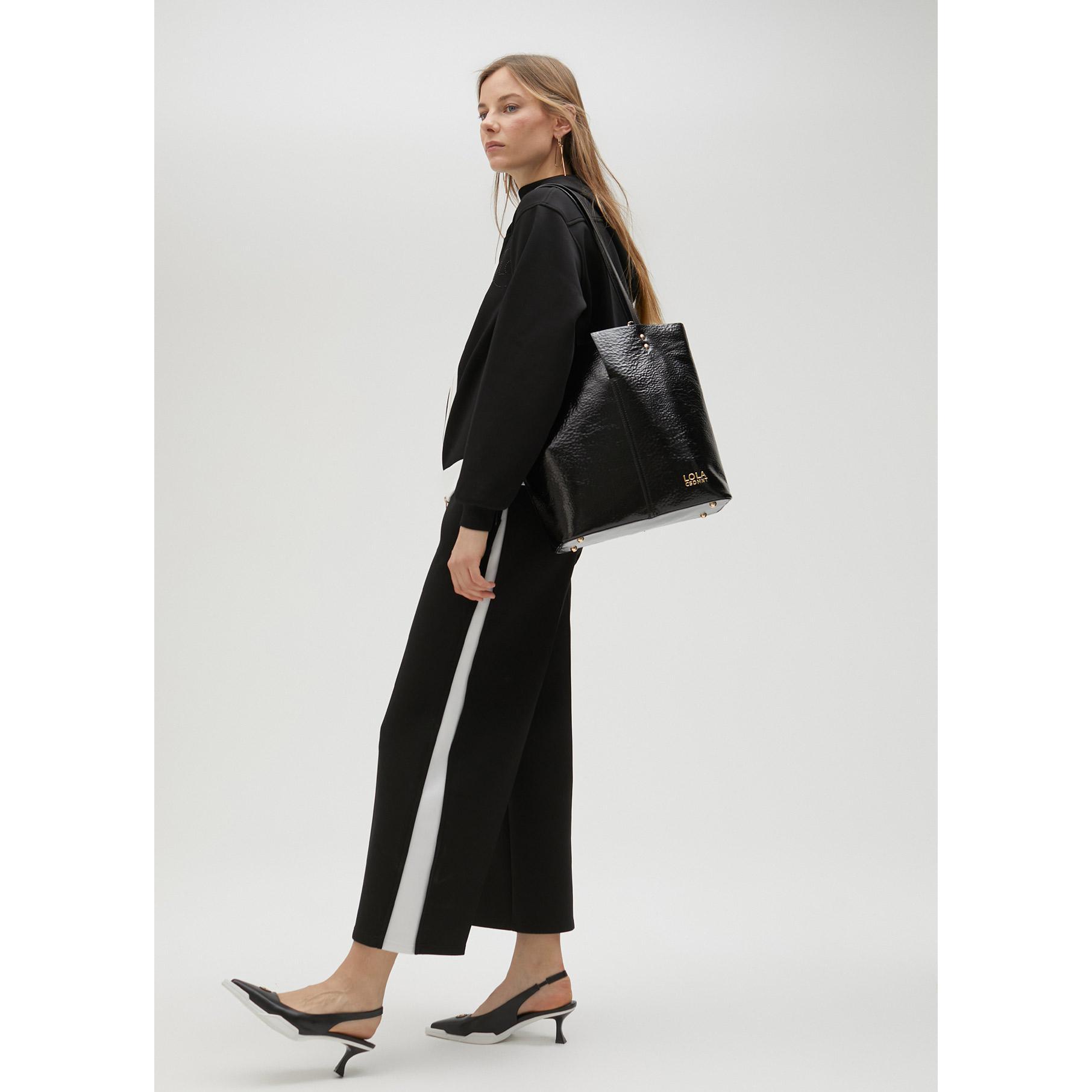 Pantaloni neri dettaglio bianco laterale