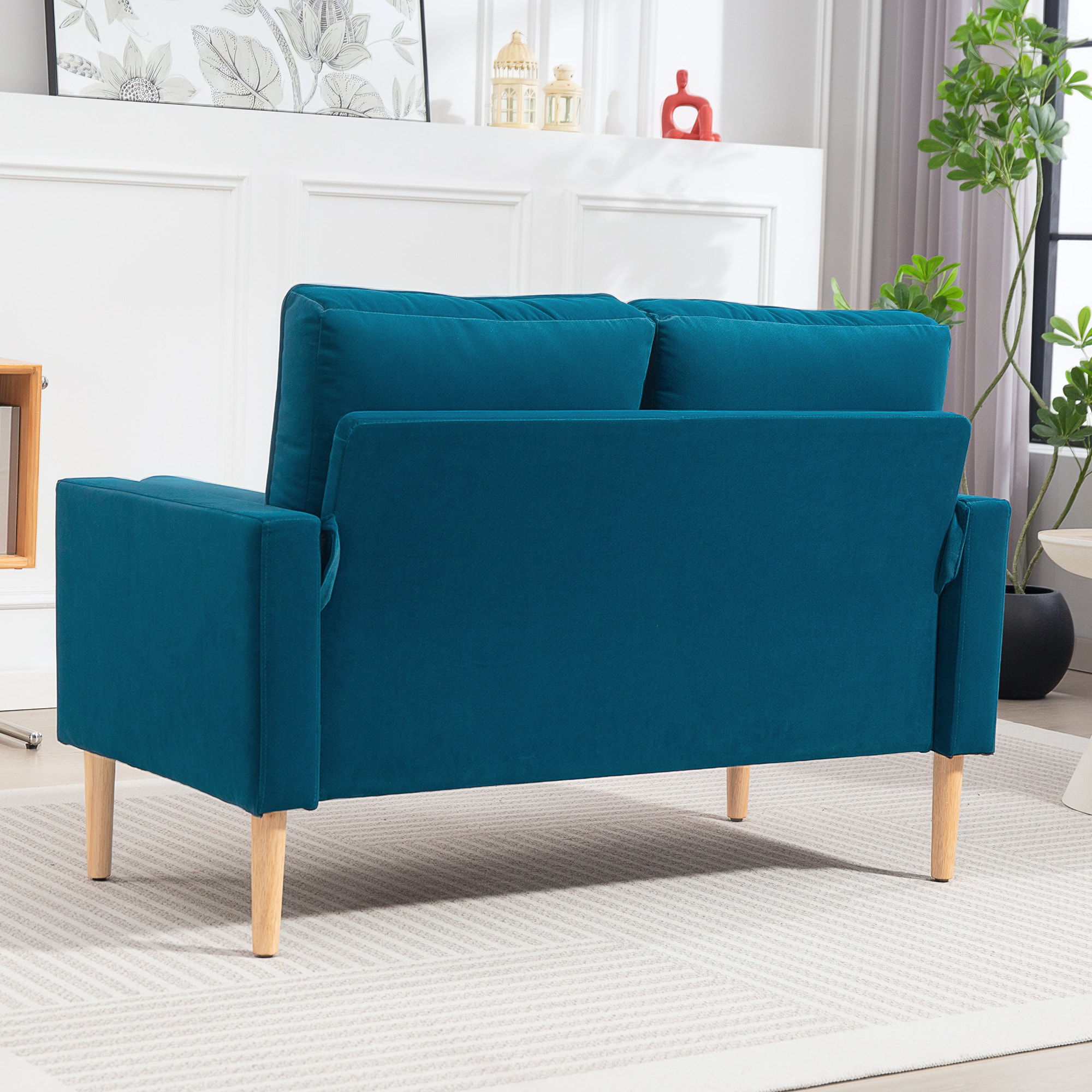 Canapé scandinave 2 places en tissu bleu canard et bois clair