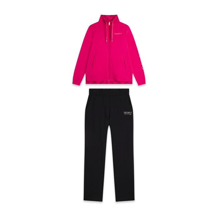 Tuta donna con zip, collo alto e spacchi laterali su fondo gamba